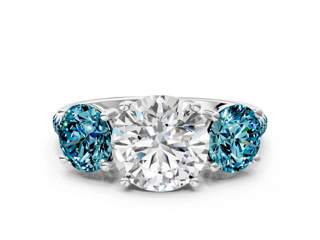 White gold Three-Stone Round Cut Diamond Ring with Round with Blue Topaz side stone Pavé Band and Prong Setting