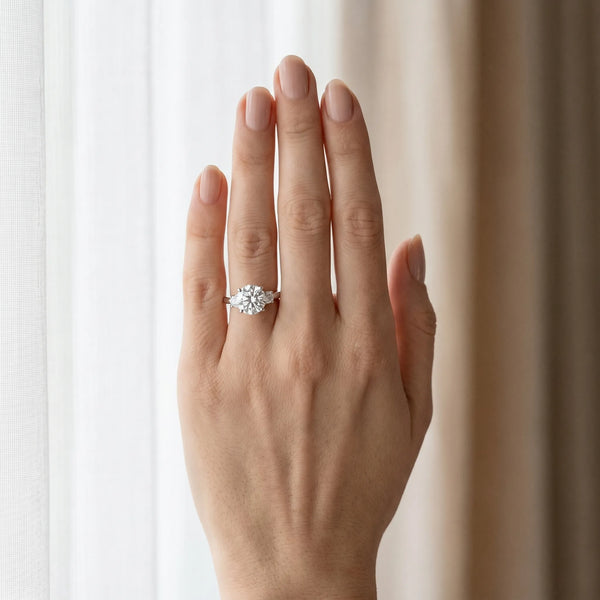 White gold Three-Stone Round Cut Diamond Solitaire with Prong Setting and Classic Band