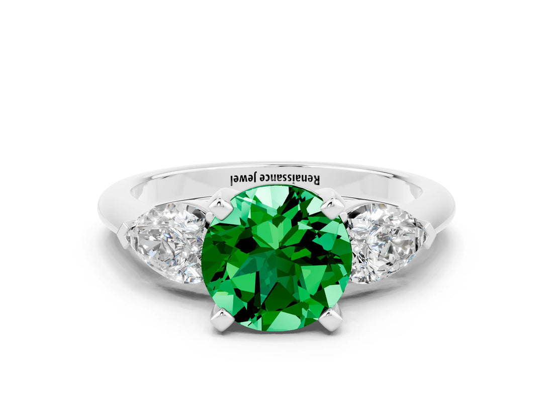 White gold Three-Stone Round Cut Emerald Ring with Pear Side Stones and Four-Prong Setting