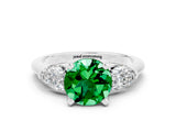 White gold Three-Stone Round Cut Emerald Ring with Pear Side Stones and Four-Prong Setting