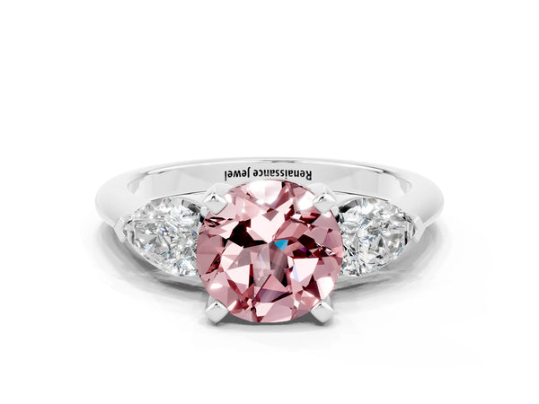 Silver Three-Stone Round Cut Morganite Ring with Pear Side Stones and Four-Prong Setting