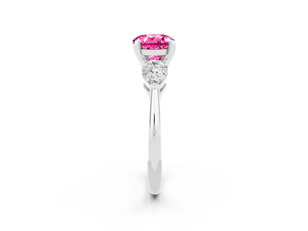 Platinum Three-Stone Round Cut Pink Sapphire Ring with Pear Side Stones and Four-Prong Setting