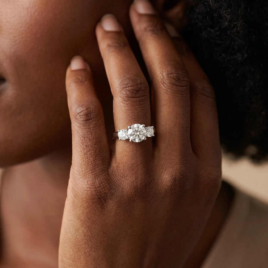 White gold Three-Stone Round Cut Solitaire Ring with Cathedral Band and Four-Prong Setting