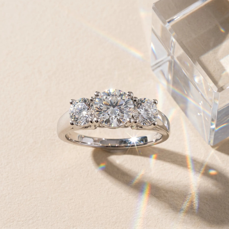 White gold Three-Stone Round Cut Solitaire Ring with Classic Band and Prong Setting