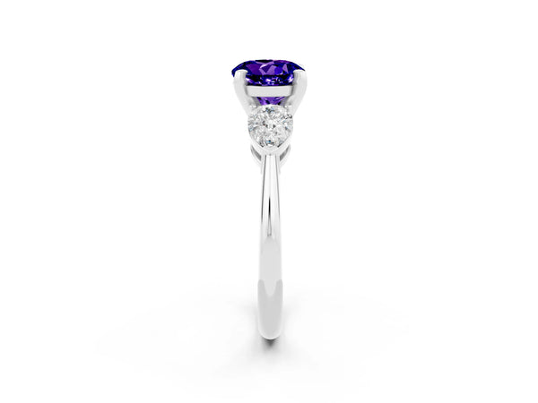 White gold Three-Stone Round Cut Tanzanite Ring with Pear Side Stones and Four-Prong Setting