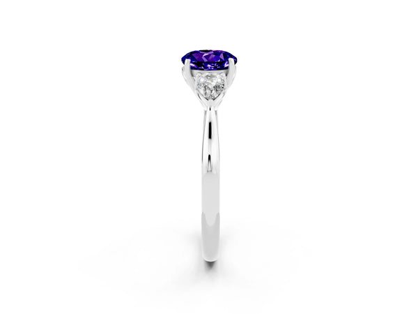 Platinum Three-Stone Round Cut Tanzanite Ring with Pear  Side Stones in Four-Prong Setting