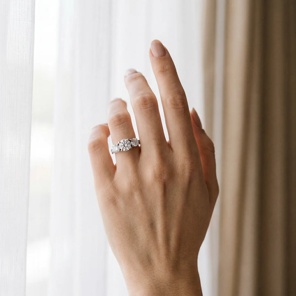 White gold Three-Stone Round Diamond Engagement Ring with Prong Setting on a Classic Band