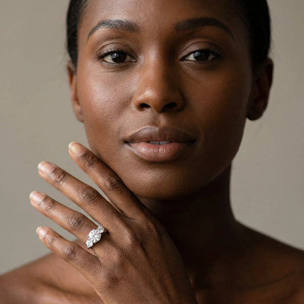 White gold Three-Stone Round Diamond Engagement Ring with Prong Setting on a Classic Band