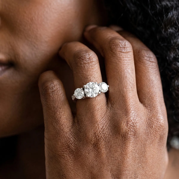 White gold Three-Stone Round Diamond Engagement Ring with Prong Setting on a Classic Band