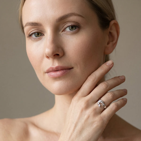 Platinum Three-Stone Round Diamond Leaf Bypass Ring with Bezel Setting