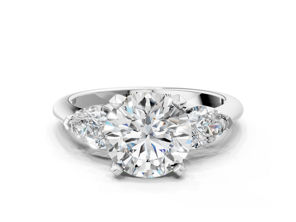 White gold Three-Stone Round Cut Diamond Ring with Pear Side Stones and Four-Prong Setting