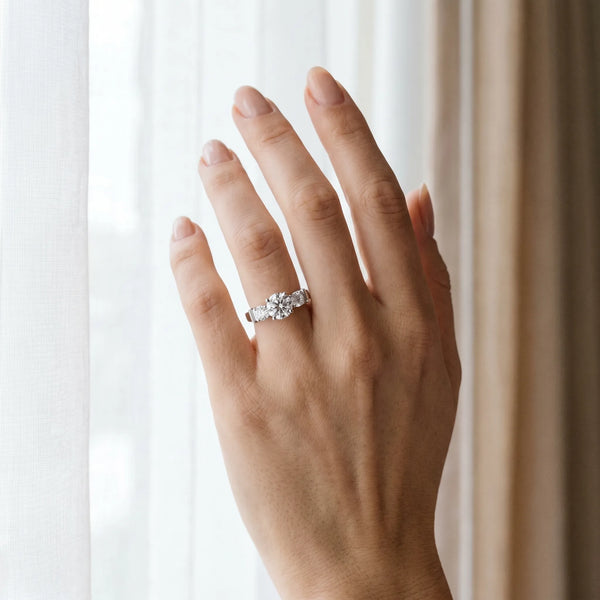 White gold Three-Stone Round Diamond Solitaire Ring with Channel Band and Prong Setting