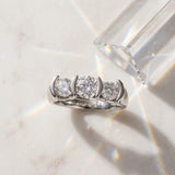 Platinum Three-Stone 6.14 Carat D VVS1 Round Diamond Trellis Engagement Ring with Channel-Set Band