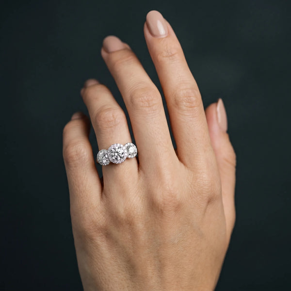 White gold Three-Stone Round Halo Diamond Ring with Pavé Band and Prong Setting