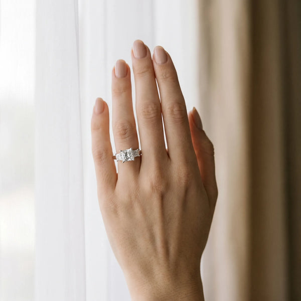 White gold Three-Stone Round and Princess Cut Diamond Ring with Channel Band and Four-Prong Setting