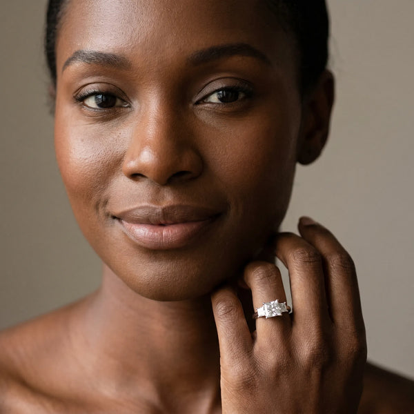 White gold Three-Stone Round and Princess Cut Diamond Ring with Channel Band and Four-Prong Setting