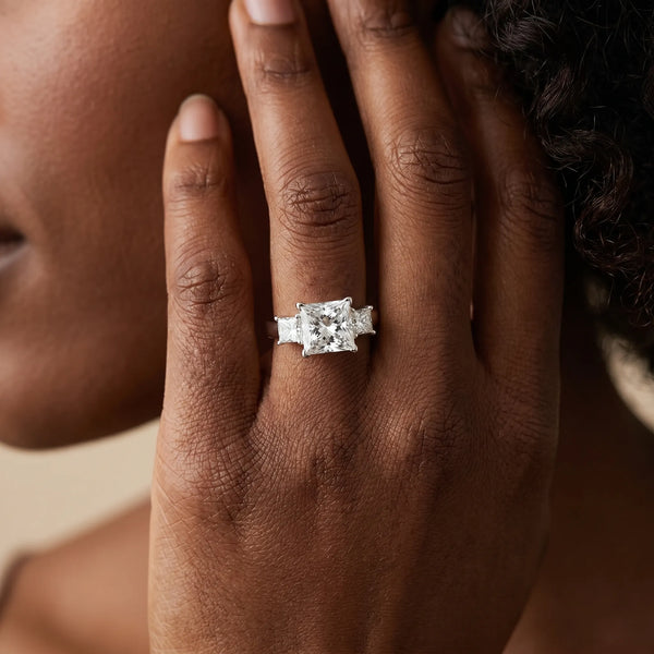 White gold Three-Stone Round and Princess Cut Diamond Ring with Channel Band and Four-Prong Setting