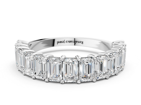 Platinum emerald cut diamond half eternity band with shared prong setting