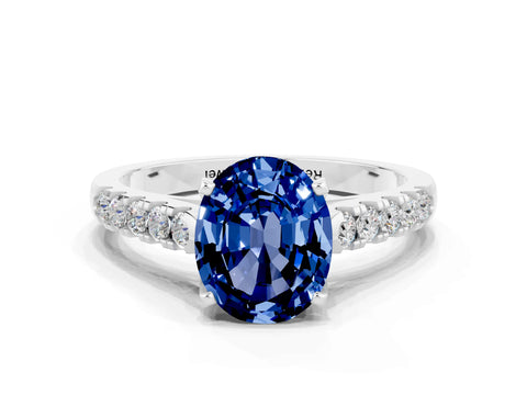 White gold {shape_name} Blue Sapphire Solitaire Ring with Pavé Band and Four-Prong Setting