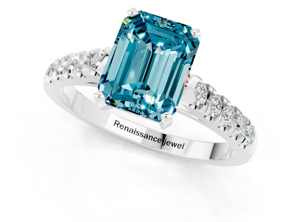 White gold Emerald Cut Blue Topaz Pavé Band Solitaire Ring with Prong Setting