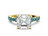 Yellow gold Asscher Cut Diamond Side Stone Solitaire Ring with Round with Blue Topaz side stone and Four-Prong Setting