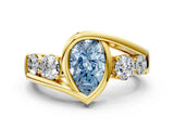 Yellow gold Bezel Set Fancy Blue Pear Cut Diamond Split Shank Ring