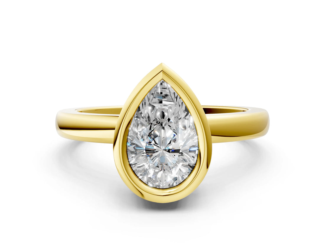 Yellow gold Bezel Set Fancy Blue Pear Cut Solitaire Engagement Ring with Classic Band