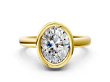 Yellow gold Bezel Set Fancy Yellow Oval Cut Solitaire Engagement Ring with Classic Band