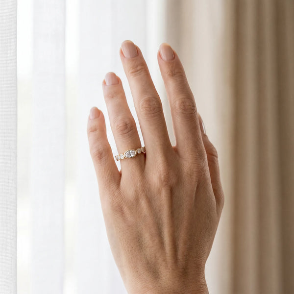 Yellow gold Bezel Set Oval Diamond Half Eternity Band