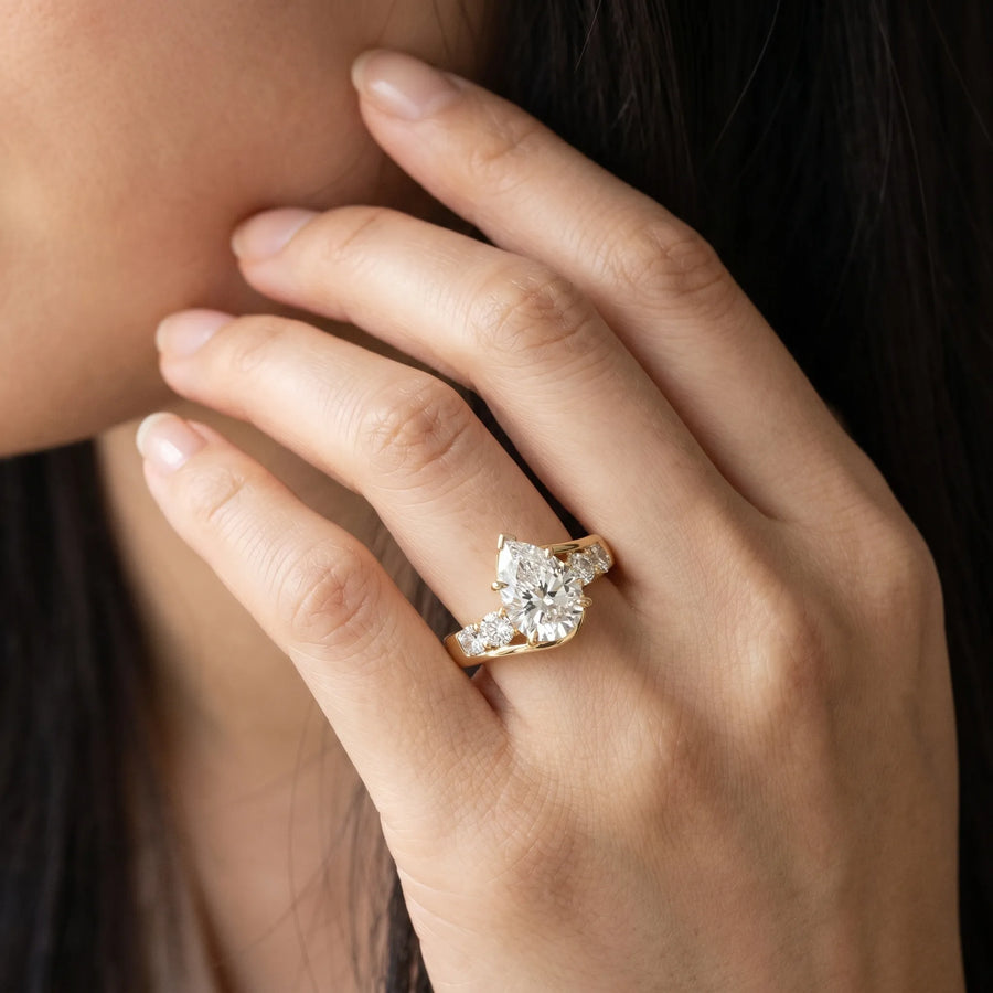 Yellow gold Bezel Set Pear Diamond Split Shank Ring