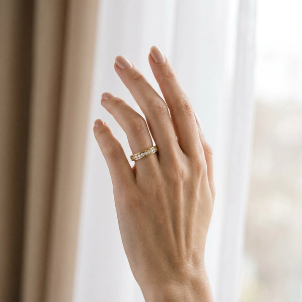 Yellow gold Channel-Set Round Diamond Eternity Band with Shared Prong Setting