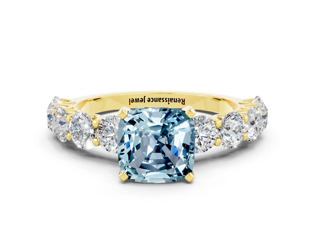 Yellow gold Cushion Cut Aquamarine Prong Setting with Side Stones on a Pave Band