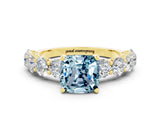 Yellow gold Cushion Cut Aquamarine Prong Setting with Side Stones on a Pave Band
