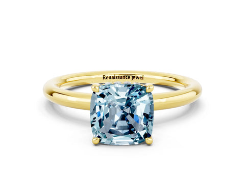 Yellow gold Cushion Cut Aquamarine Solitaire Ring with Thin Band and Four-Prong Setting