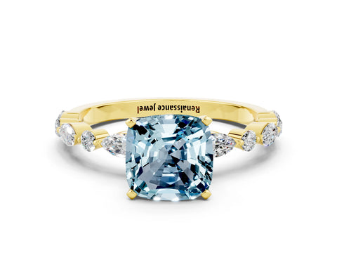 Yellow gold Cushion Cut Aquamarine Solitaire with Side Stones on a Pavé Band and Four-Prong Setting