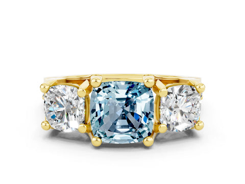Yellow gold Cushion Cut Aquamarine Three-Stone Ring with Channel Set Band and Four-Prong Setting