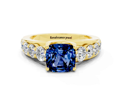 Yellow gold Cushion Cut Blue Sapphire Engagement Ring with Pavé Band and Four-Prong Setting
