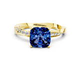 Yellow gold Cushion Cut Blue Sapphire Engagement Ring with Side Stone Accents and Four-Prong Setting_24