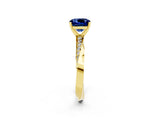 Yellow gold Cushion Cut Blue Sapphire Engagement Ring with Side Stone Accents and Four-Prong Setting_86