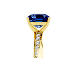 Yellow gold Cushion Cut Blue Sapphire Engagement Ring with Side Stone Accents and Four-Prong Setting_89