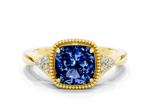 Yellow gold Cushion Cut Blue Sapphire Halo Ring with Tapered Band and Four-Prong Setting