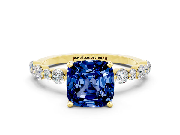 Yellow gold Cushion Cut Blue Sapphire Prong Set Engagement Ring with Pavé Band