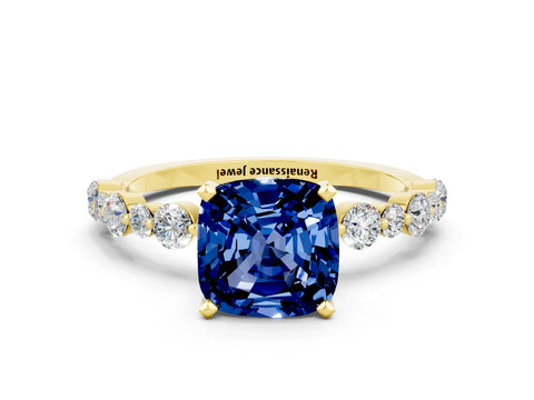 Yellow gold Cushion Cut Blue Sapphire Prong Set Engagement Ring with Pavé Band