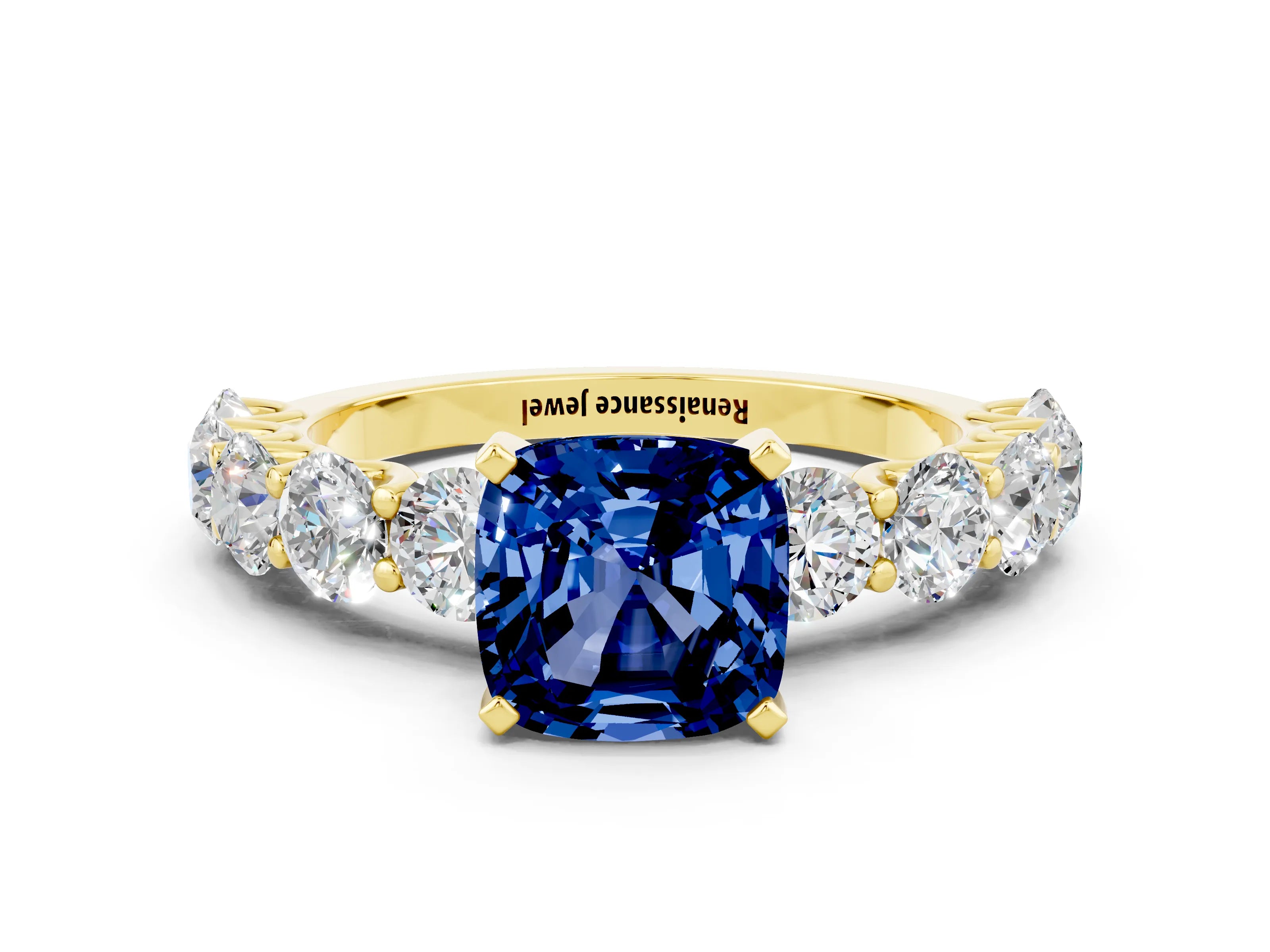 Yellow gold Cushion Cut Blue Sapphire Prong Setting with Side Stones on a Pave Band