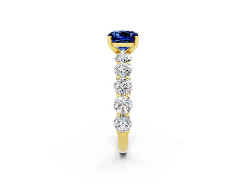 Yellow gold Cushion Cut Blue Sapphire Prong Setting with Side Stones on a Pave Band_2