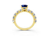 Yellow gold Cushion Cut Blue Sapphire Prong Setting with Side Stones on a Pave Band_3