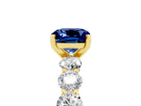 Yellow gold Cushion Cut Blue Sapphire Prong Setting with Side Stones on a Pave Band_5