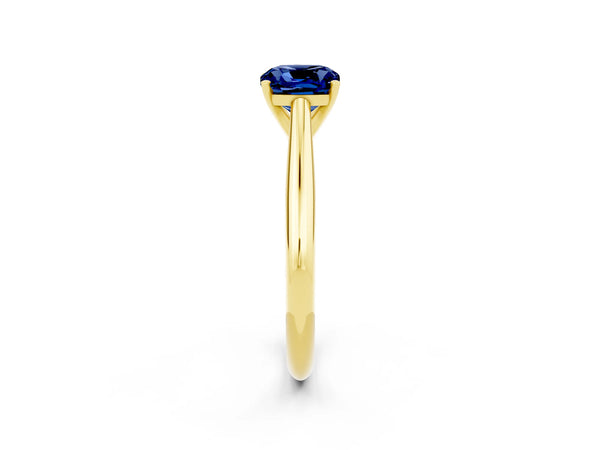 Yellow gold Cushion Cut Blue Sapphire Solitaire Engagement Ring with Cathedral Setting and Four-Prong Mount