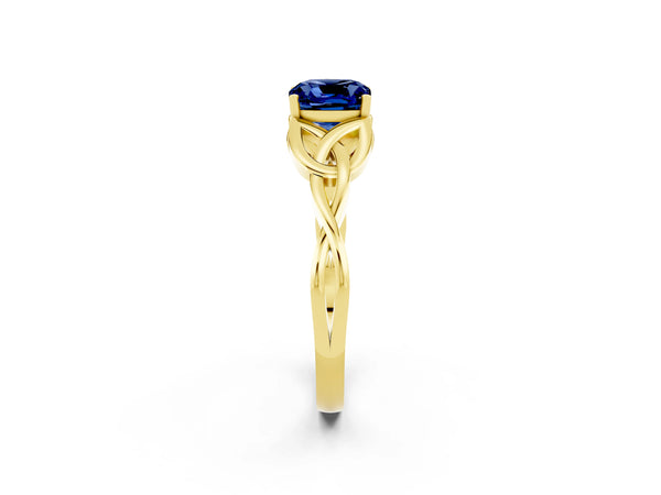 Yellow gold Cushion Cut Blue Sapphire Solitaire Engagement Ring with Celtic Knot Band and Four-Prong Setting