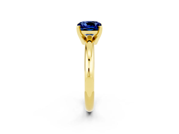Yellow gold Cushion Cut Blue Sapphire Solitaire Engagement Ring with Round Band and Four-Prong Setting